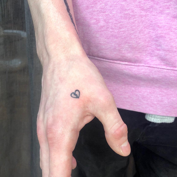 Minimal broken heart design tattoo
