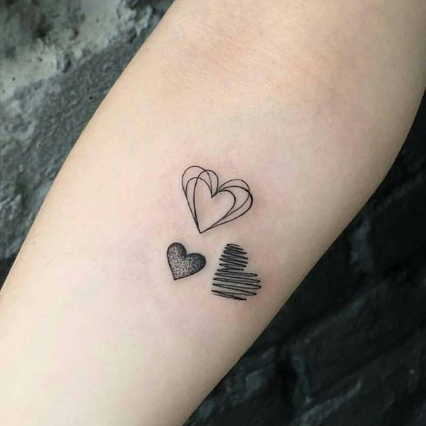 Trendy black line art small heart tattoo