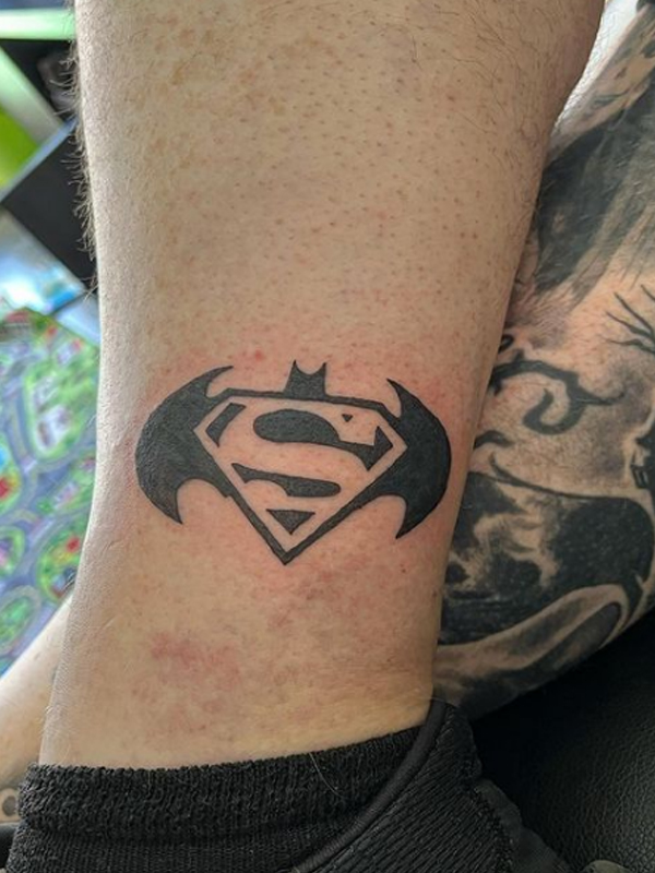 Black crips line Superman and Batman logo tattoo