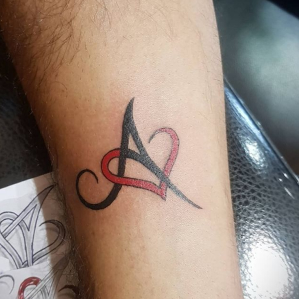 Awesome A-letter and small heart tattoo design