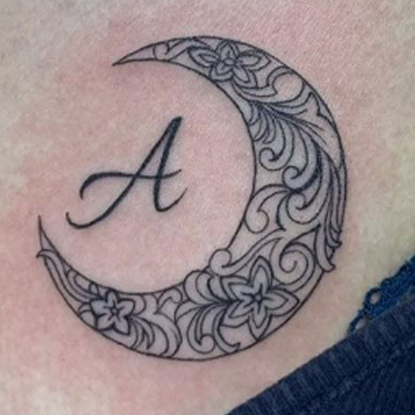 Stunning A-letter and detailing moon tattoo 