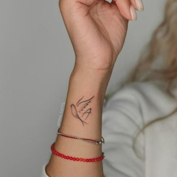 Creative small bird and A-letter tattoo design