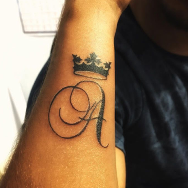 Black and bold a-letter and crown tattoo design