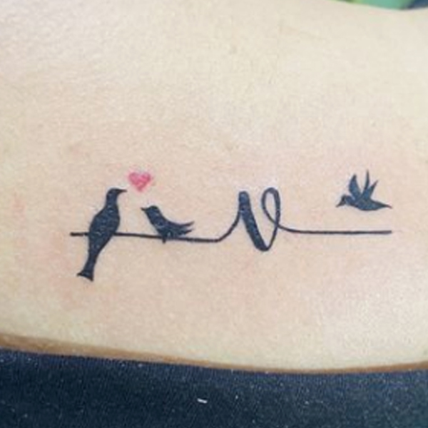 Amazing v-letter and small bird tattoo design