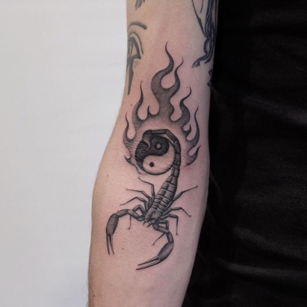 Elegant Scorpio yin-yang and fire tattoo