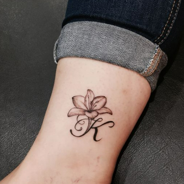 Pretty k-letter and flower tattoo design