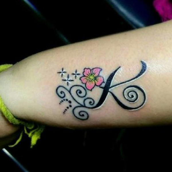 Gracious K-letter, flower, and star tattoo design