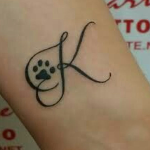 Stunning K-letter and little paw, animal tattoo design