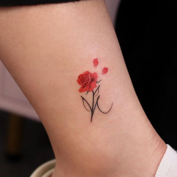 Awesome k-letter and rose tattoo design