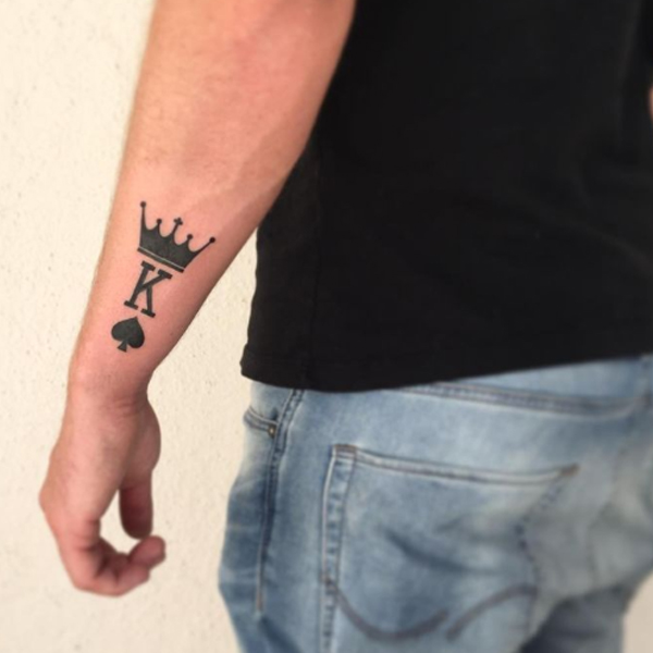Classy K-letter, crown, and Ace symbol tattoo