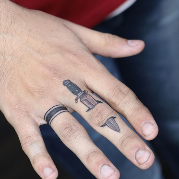 Dazzling minimal knife under the skin finger tattoo