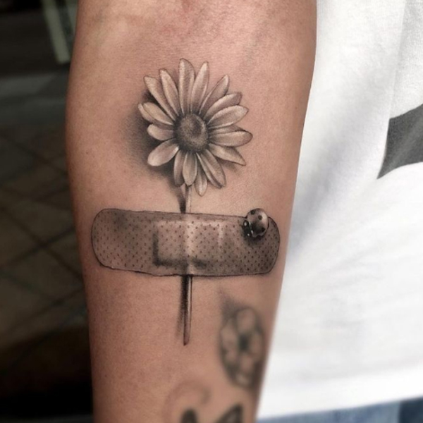 Beautiful 3d daisy flower, banded, and ladybug tattoo 