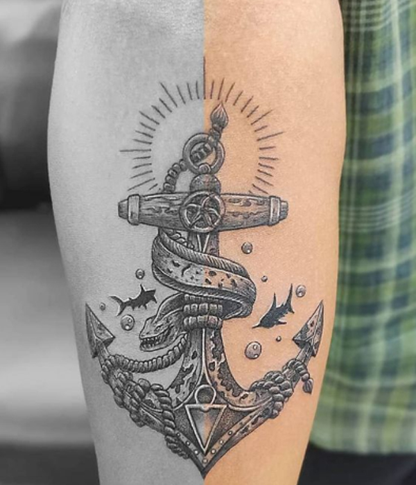 Attractive black and grey anchor and little sharks tattoo