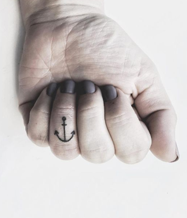 Beautiful tiny anchor finger tattoo design