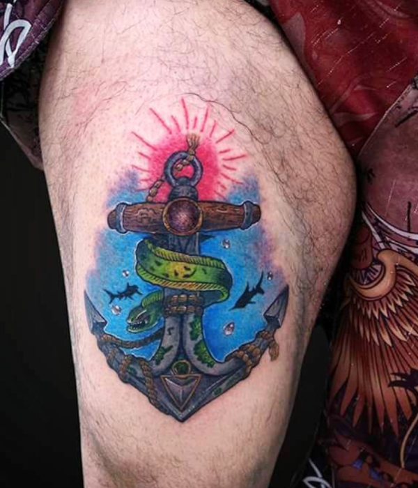 Beautiful anchor and sea view tattoo over the thigh