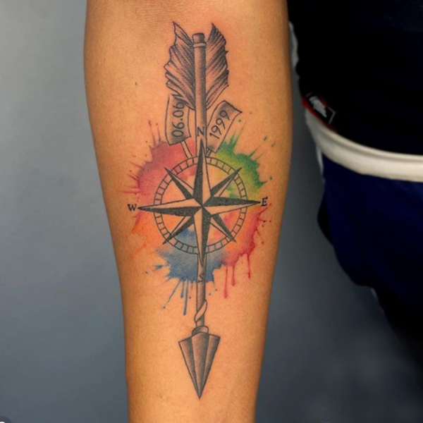 Attractive watercolor Arrow and compass tattoo design