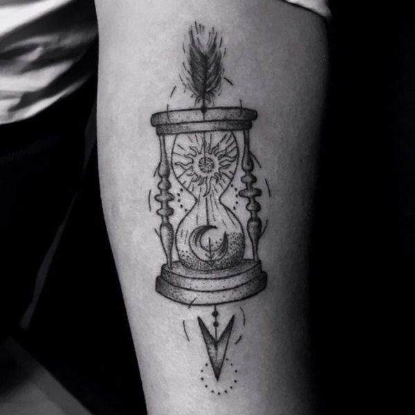 Black and grey arrow and hourglass tattoo design