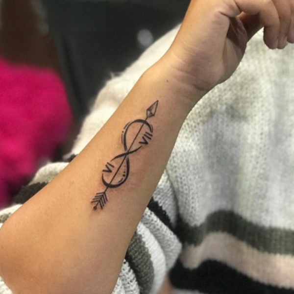 Pretty Arrow and infinity tattoo design on the hand