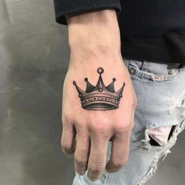 Elegant black and grey crown small tattoo for hand