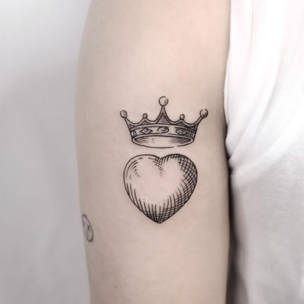Fine line art crown and small heart tattoo