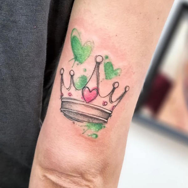 Awesome crown and watercolor small heart tattoo over the arm