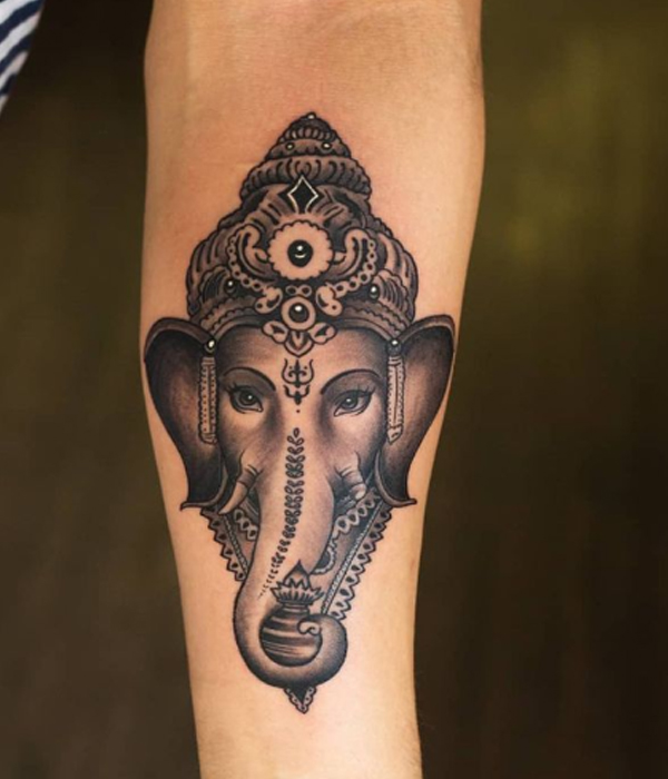 Elegant Ganesha hyper-realism tattoo on the hand