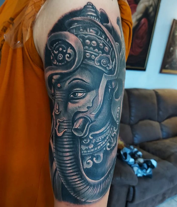 Awesome black and grey lord Ganesh tattoo 