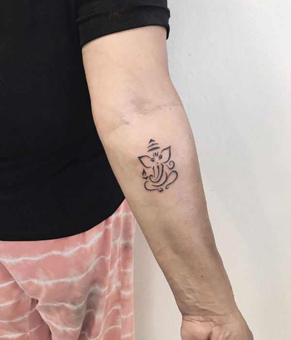 Tiny cute Ganesha minimal tattoo design