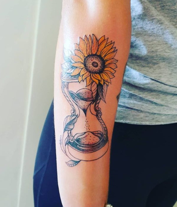 Elegant hourglass and sunflower tattoo