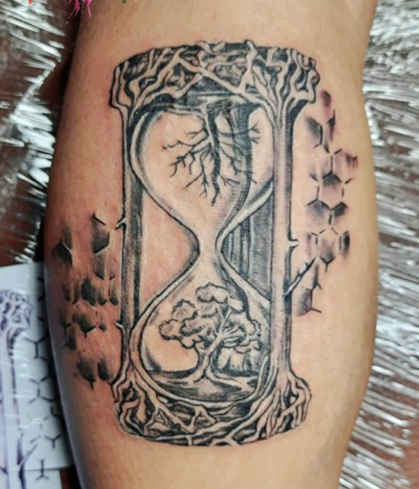 Stunning hourglass nature tattoo design