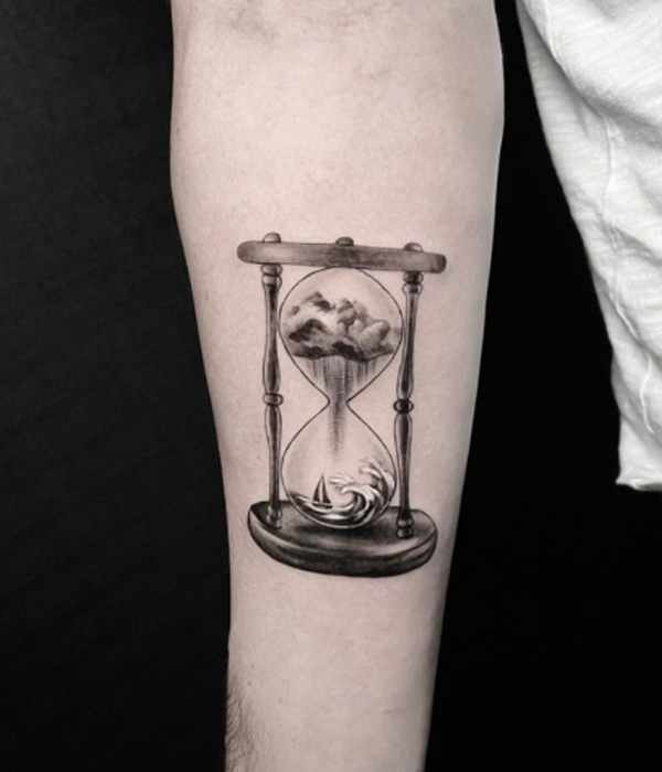 Splendid black and grey hourglass, clouds, and boat tattoo design