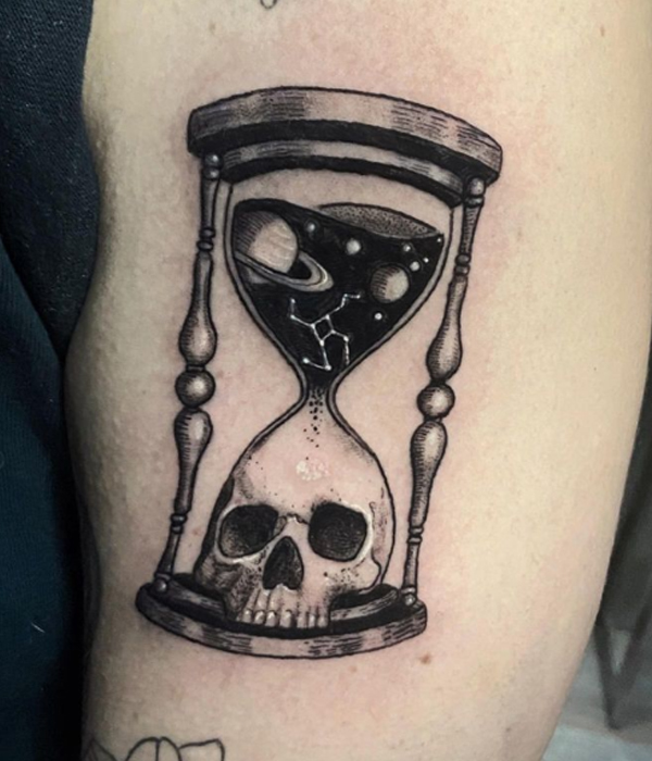 Elegant black hourglass and skull tattoo design