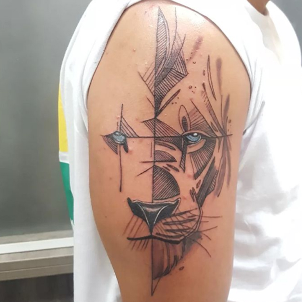 Elegant hatching line lion tattoo on the bicep
