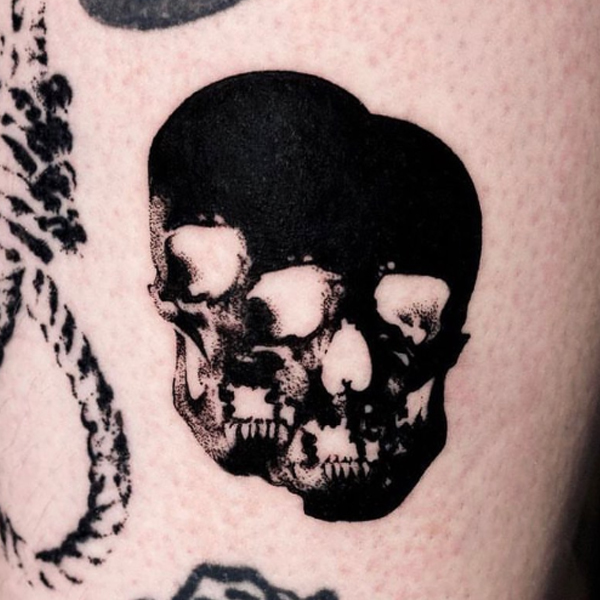 Black and bold twin skull tattoo design