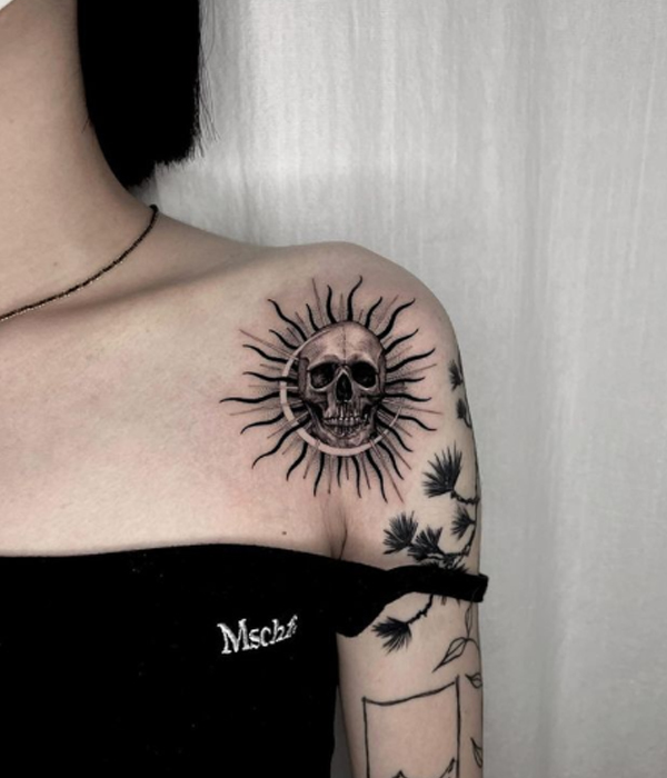 Awesome skull sun tattoo on the shoulder