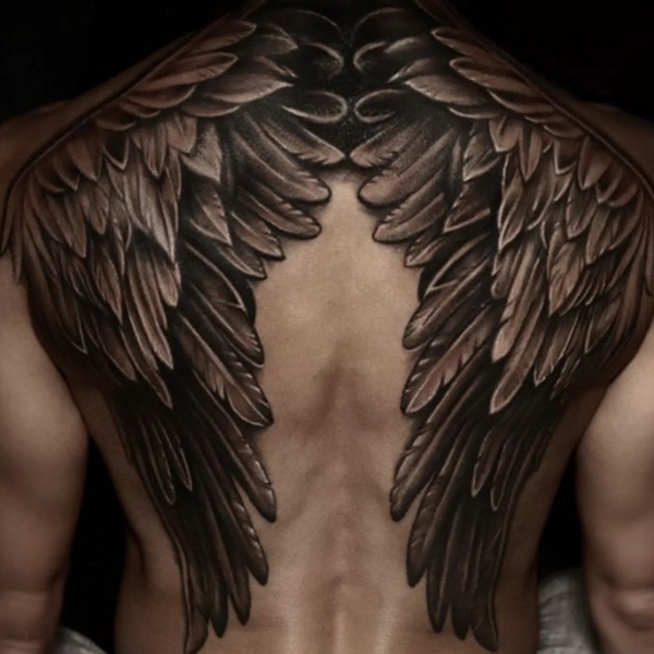 Gracious large wings over the back full body tattoo design
