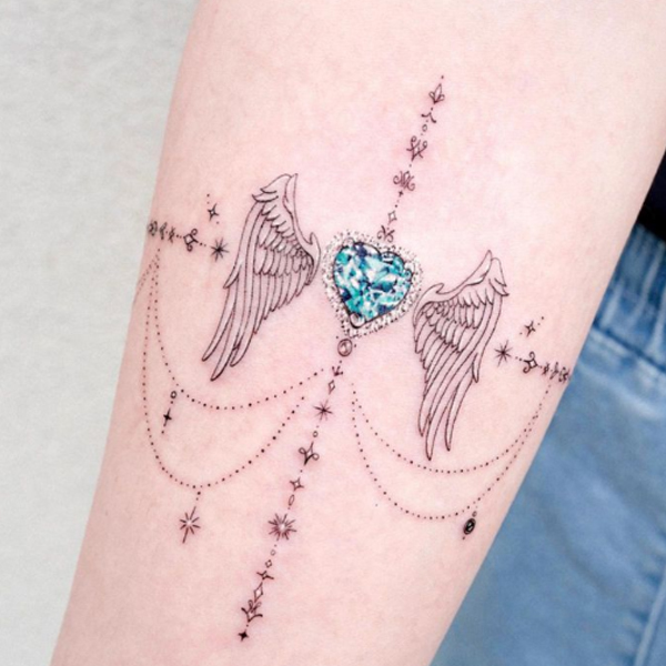 Awesome ornamental wing and small heart tattoo design 