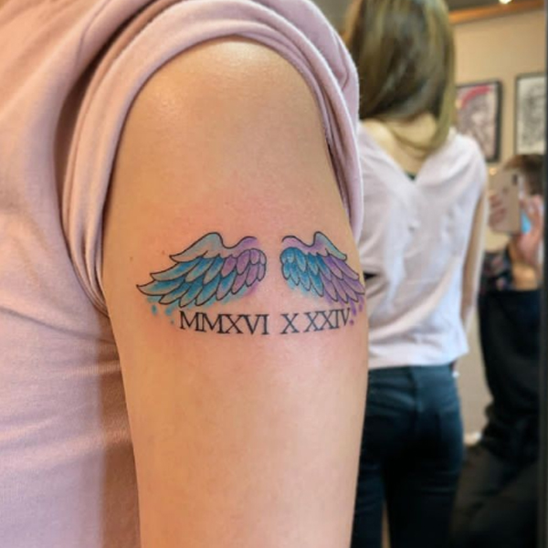 Awesome wing small colorful tattoo 