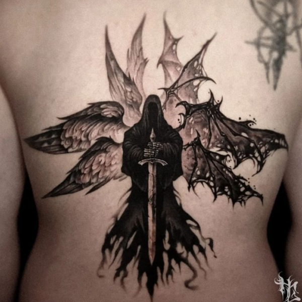 Stunning fallen angel wings tattooed over the back