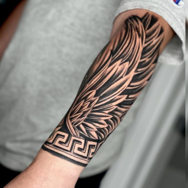Stunning big wing and Celtic armband tattoo design