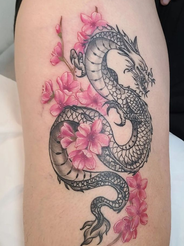 Splendid Haku dragon and pink flowers tattoo
