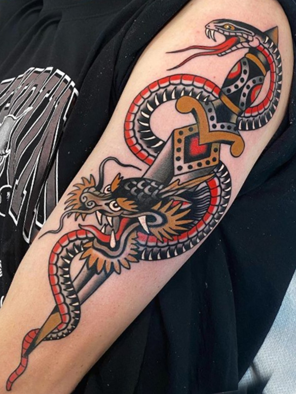 A snake and dragon with a knife, an old-school tattoo