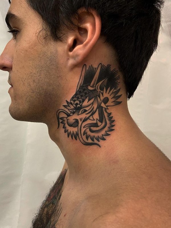 Small black n grey dragon tattoo on the neck