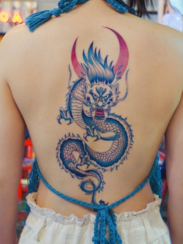 A specific blue dragon and moon back piece tattoo