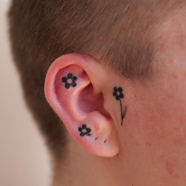 Elegant mini black flower ear tattoo design