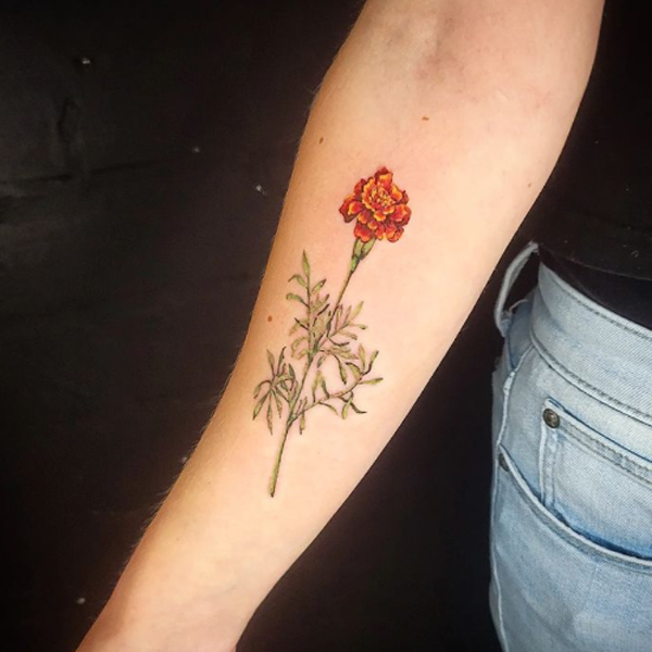Lovely French marigold flower design tattoo