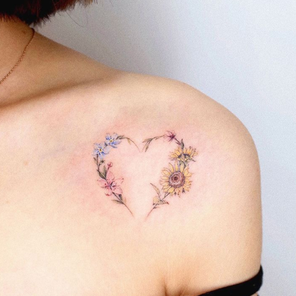 Awesome flower small heart tattoo design over the shoulder