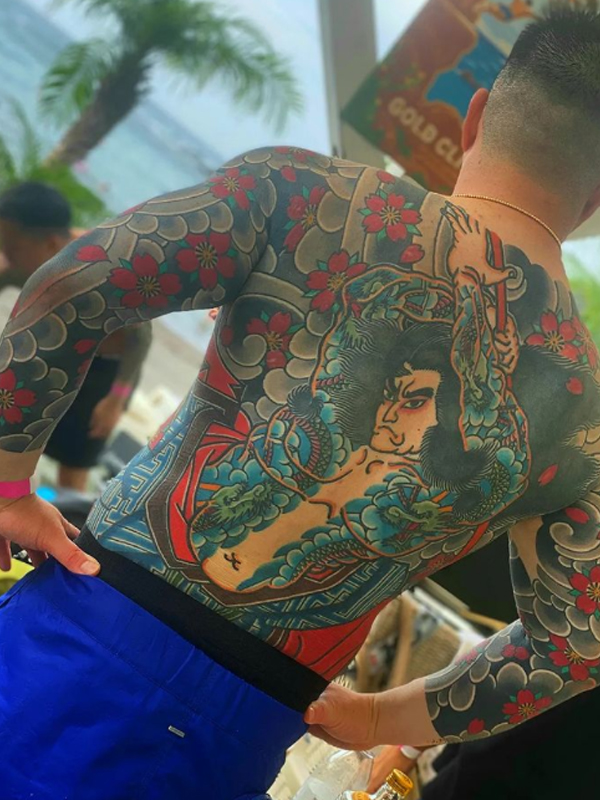 Amazing Full body tattoo design over full-back and both arm