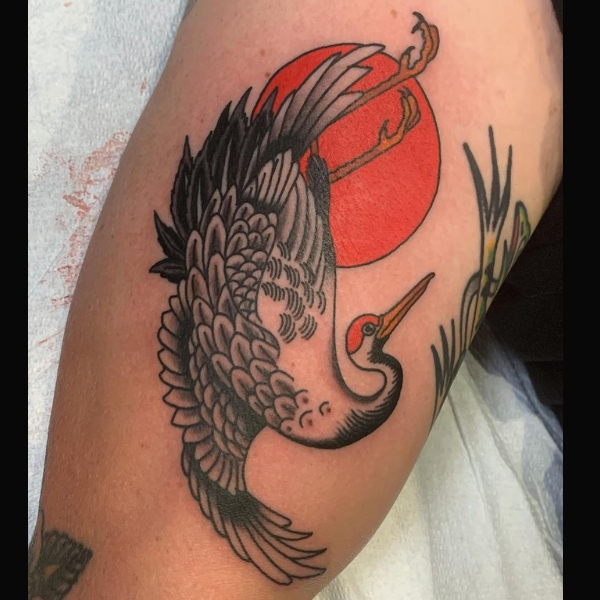A beautiful Japanese crane and sun, a small bird tattoo design