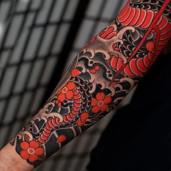 Awesome dragon and cherry blossom flower arm tattoo
